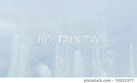 Streams of water from fountain 50852977
