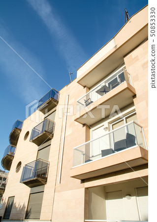 A light cream apartment in the morning sun under a deep blue sky at Majorca Island A light cream apartment in the morning sun under a deep blue sky at Majorca Island 50853330