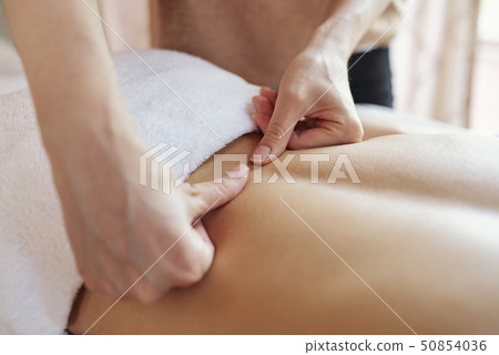 Chiropractor pushing sensitive spots Chiropractor pushing sensitive spots 50854036