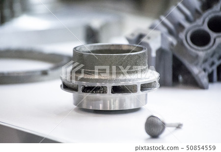 Man is holding object printed on metal 3d printer Man is holding object printed on metal 3d printer 50854559
