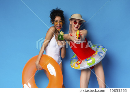 Diverse young women in summer clothes and accessories 50855263