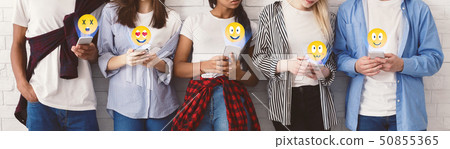 Social networks. Students sending emojis, texting on phones Social networks. Students sending emojis, texting on phones 50855365