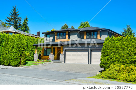 Stylish suburban house with double garage and concrete driveway 50857773