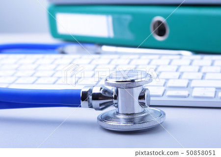 books folder file, stethoscope and laptop, keyboard isolated on white background. books folder file, stethoscope and laptop, keyboard isolated on white background. 50858051