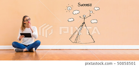 Standing on the top of a mountain with woman using a tablet Standing on the top of a mountain with woman using a tablet 50858501