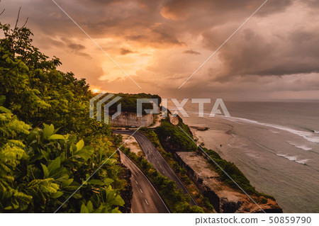 Beautiful sunrise with road and ocean beach 50859790