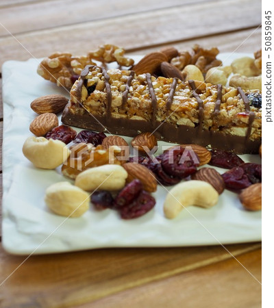 Chocolate bars, nuts, almonds, walnuts, raspberries, cashew nuts Chocolate bars, nuts, almonds, walnuts, raspberries, cashew nuts 50859845