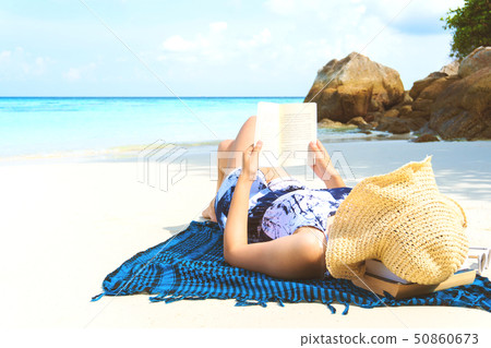 Summer Beach Holiday Woman reading a book on the 50860673