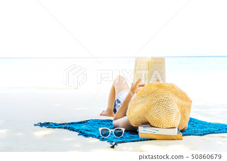 Summer Beach Holiday Woman reading a book on the Summer Beach Holiday Woman reading a book on the 50860679