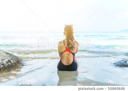 Summer Beach Holiday Woman relax on the beach in Summer Beach Holiday Woman relax on the beach in 50860686