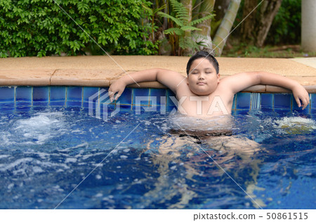 Obese boy relaxing enjoying hot tub 50861515