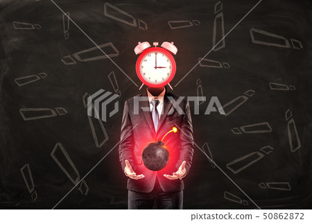 Businessman with clock instead of head holding ball bomb with fuse on black background with 50862872
