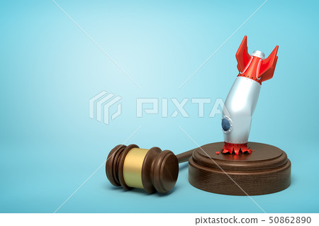 3d rendering of crashed space rocket upside down on sounding block with judge gavel lying beside on 50862890
