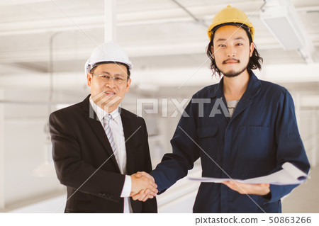 Asian engineer handshakes with executive engineer 50863266
