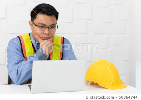 Asian man working Asian man working 50864744