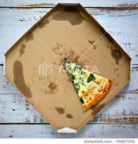 Delicious fresh pizza in a box on a wooden Delicious fresh pizza in a box on a wooden 50867298