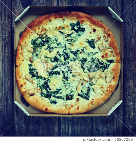 Delicious fresh pizza served on wooden table. Delicious fresh pizza served on wooden table. 50867299