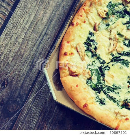Delicious fresh pizza served on wooden table. Delicious fresh pizza served on wooden table. 50867301