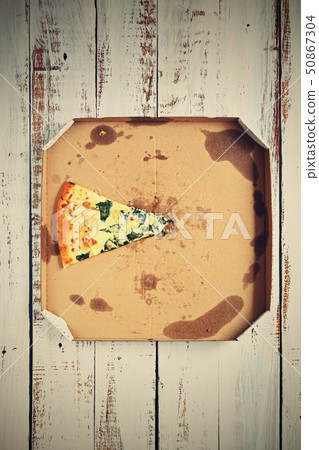 Delicious fresh pizza in a box on a wooden Delicious fresh pizza in a box on a wooden 50867304