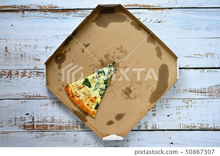 Delicious fresh pizza in a box on a wooden Delicious fresh pizza in a box on a wooden 50867307