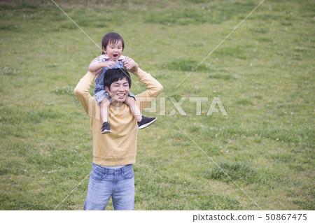 Young father shouldering, childcare image 50867475