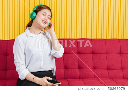 Asian woman listen to music 50868979