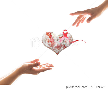 World aids day with red ribbon awareness on heart  50869326