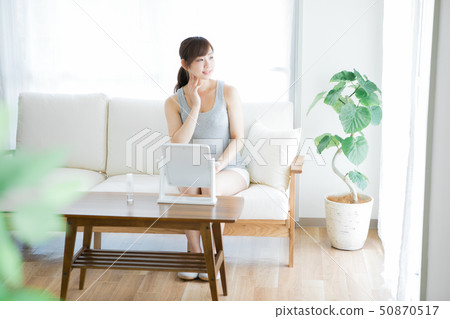 Woman checking skin with mirror Woman checking skin with mirror 50870517