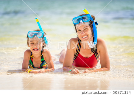 Young mother and little daughter enjoying the beach in Dominican Republic 50871354