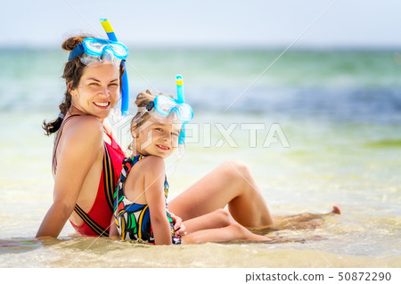Young mother and little daughter enjoying the beach in Dominican Republic Young mother and little daughter enjoying the beach in Dominican Republic 50872290