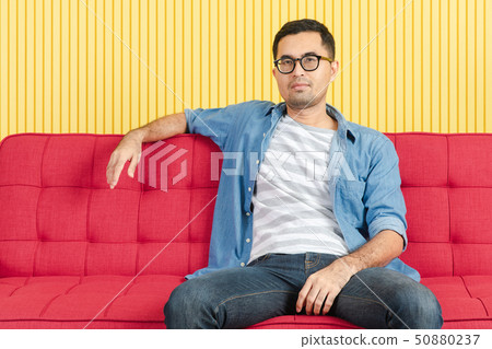 Young man with denim shirt 50880237