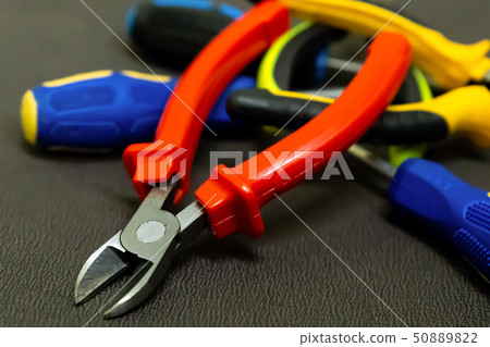 pile of tools of hand red nippers on the 50889822