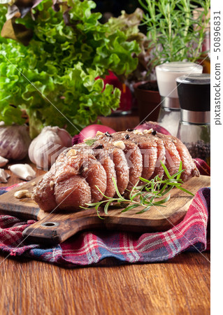 Marinated pork ham ready for roasting 50896831