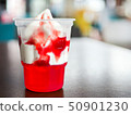 Ice cream with strawberry sauce and red jelly 50901230