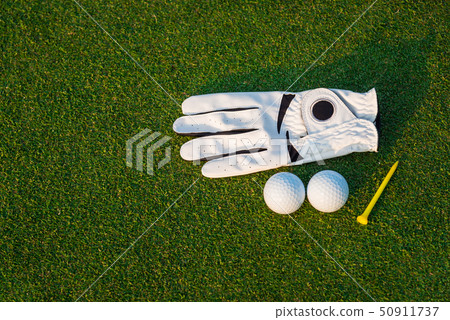 The golf sport white glove ,golf ball, yellow tee The golf sport white glove ,golf ball, yellow tee 50911737