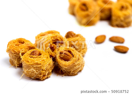 Arabic kadayif dessert with cashew nuts isolated Arabic kadayif dessert with cashew nuts isolated 50918752