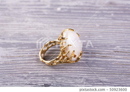 The ring in a gold frame is executed with big skil 50923600