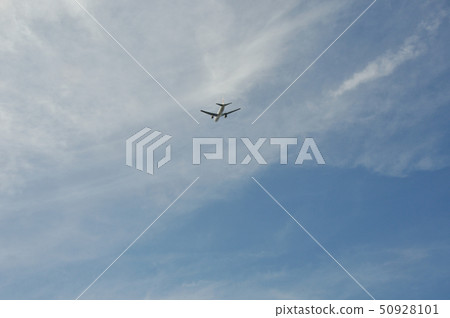 Blue sky and clouds and airliner 50928101