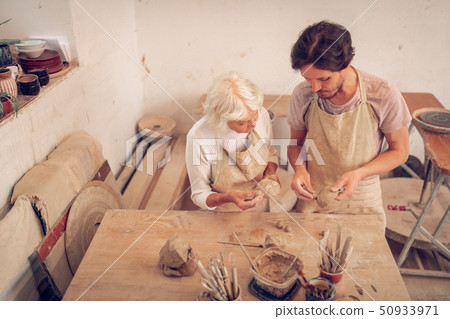 Top view of two nice creative people Top view of two nice creative people 50933971