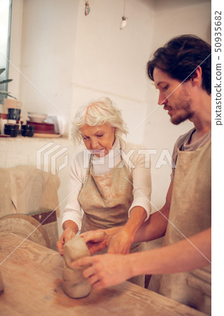 Nice aged woman focusing on her work Nice aged woman focusing on her work 50935682