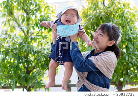 Parents and children enjoying in fresh green 50938722