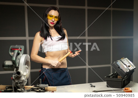 Women standing builder wearing white shirt worker 50940985