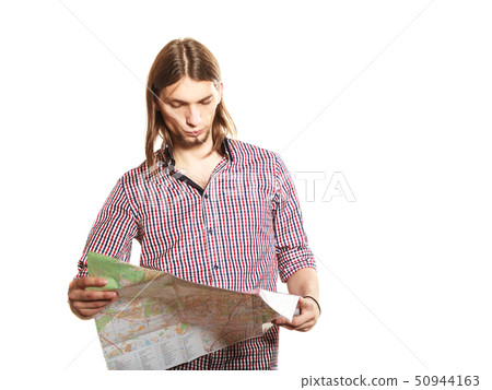 Man tourist reading map on trip. Summer travel. Man tourist reading map on trip. Summer travel. 50944163