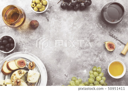 Snacks with wine - various types of cheeses, figs, 50951411