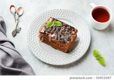 A piece of truffle cake with chocolate  50952097