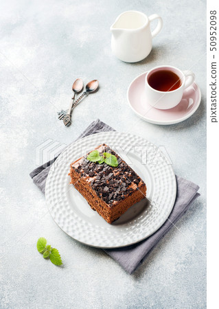 A piece of truffle cake with chocolate  50952098