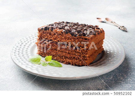 A piece of truffle cake with chocolate  50952102