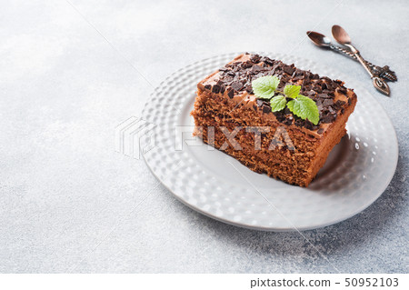 A piece of truffle cake with chocolate  50952103