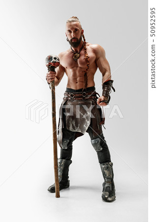 Man in leather viking's costume isolated on white studio background 50952595