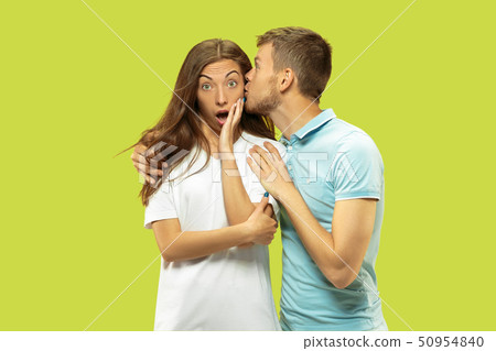 Beautiful couple isolated on green studio background 50954840